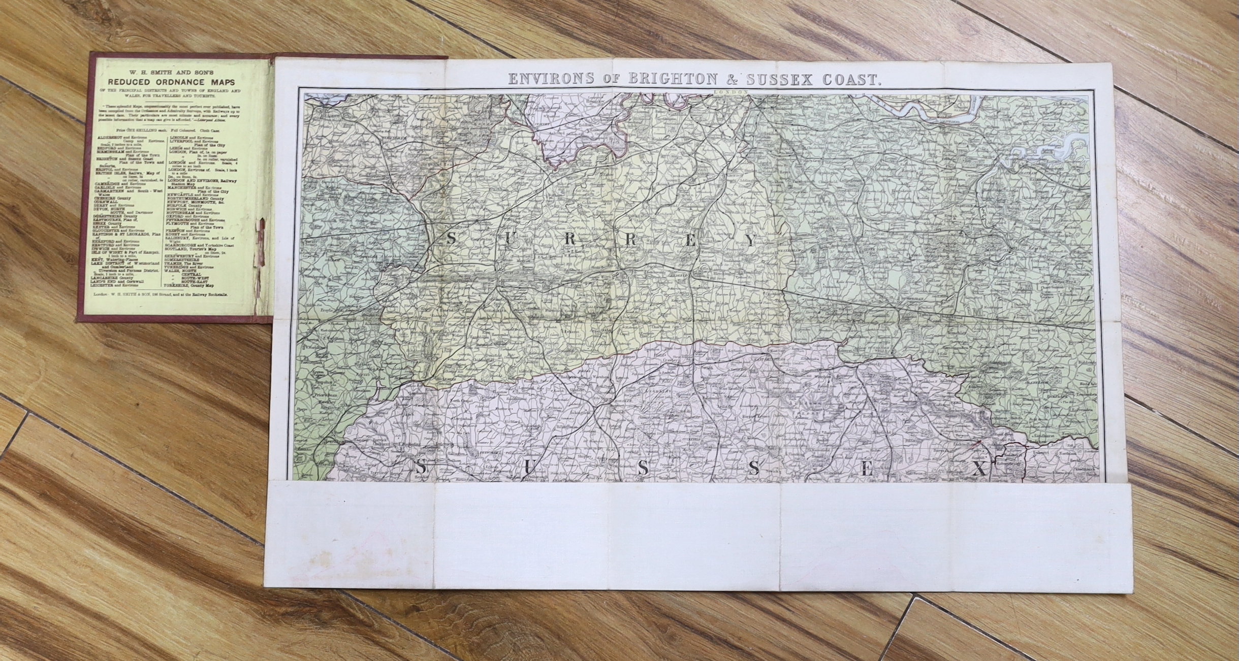 Six 19th and 20th century folding maps of Sussex; an Ordnance Survey (318), a W.H. Smith & Son map, a Smith & Son 172 Strand 1864, two Walker’s County Maps, and a Kelly’s Map